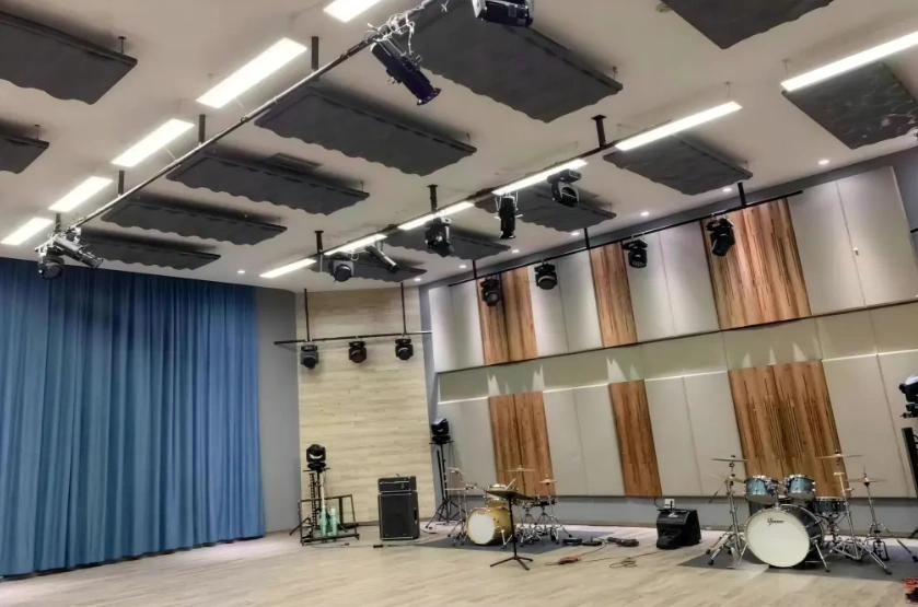 Acoustic panels installed across the walls and ceiling of a music rehearsal room