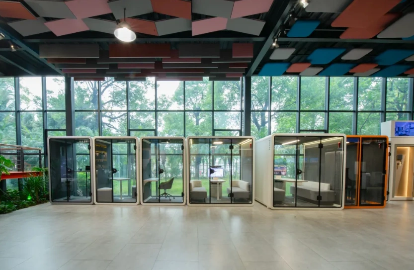 Soundbox acoustic pods in different sizes displayed in a modern showroom